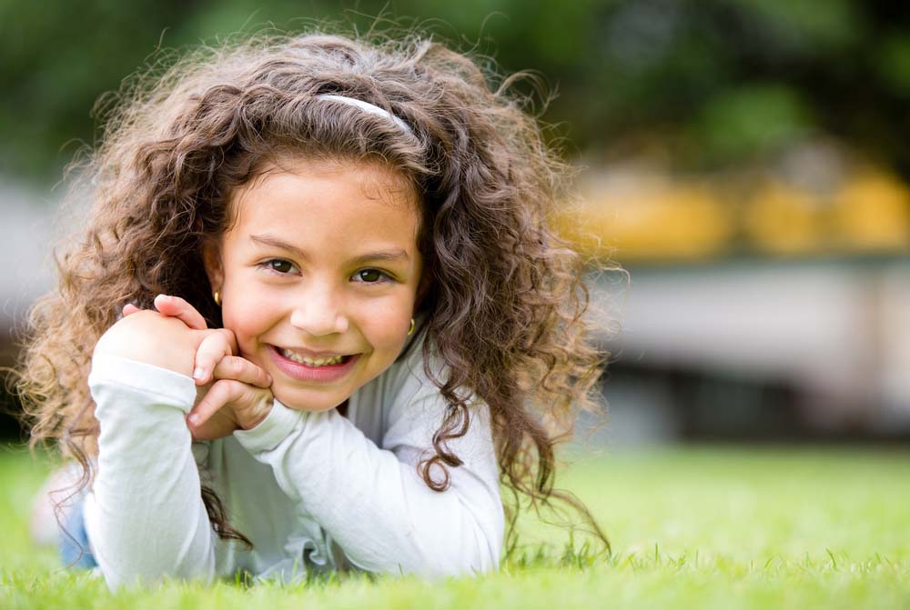 Smiling child representing preventive pediatric dental care.