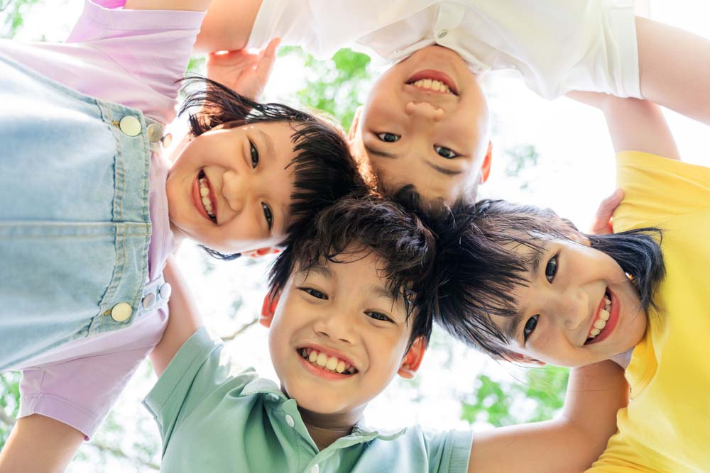 Smiling child enjoying summer, representing healthy teeth.