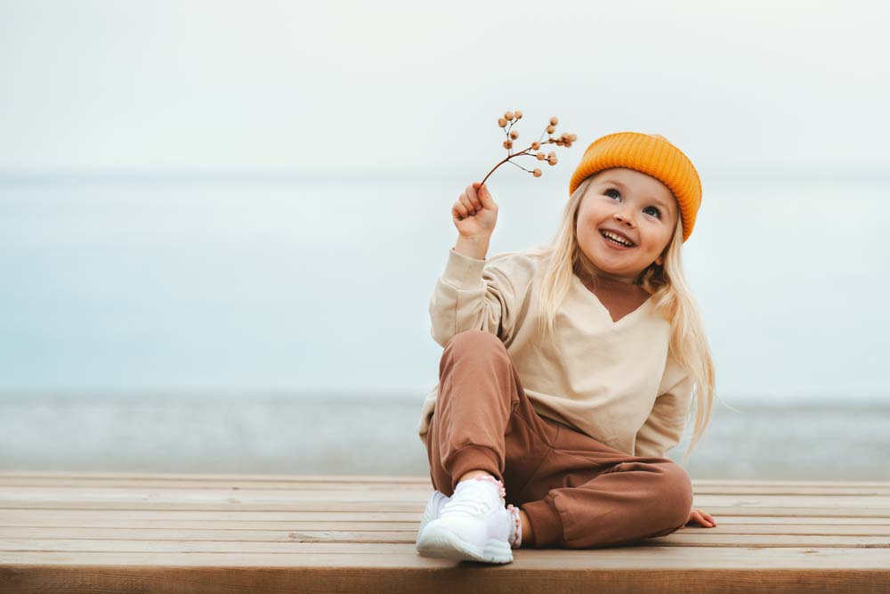 Children playing outdoors symbolizing healthy smiles and confidence.