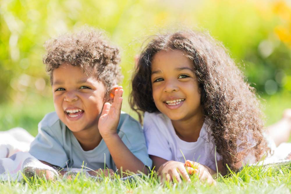 Smiling mother representing trust in pediatric dental care.